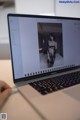 A laptop computer sitting on top of a white table.