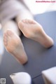 A close up of a person's feet on a table.