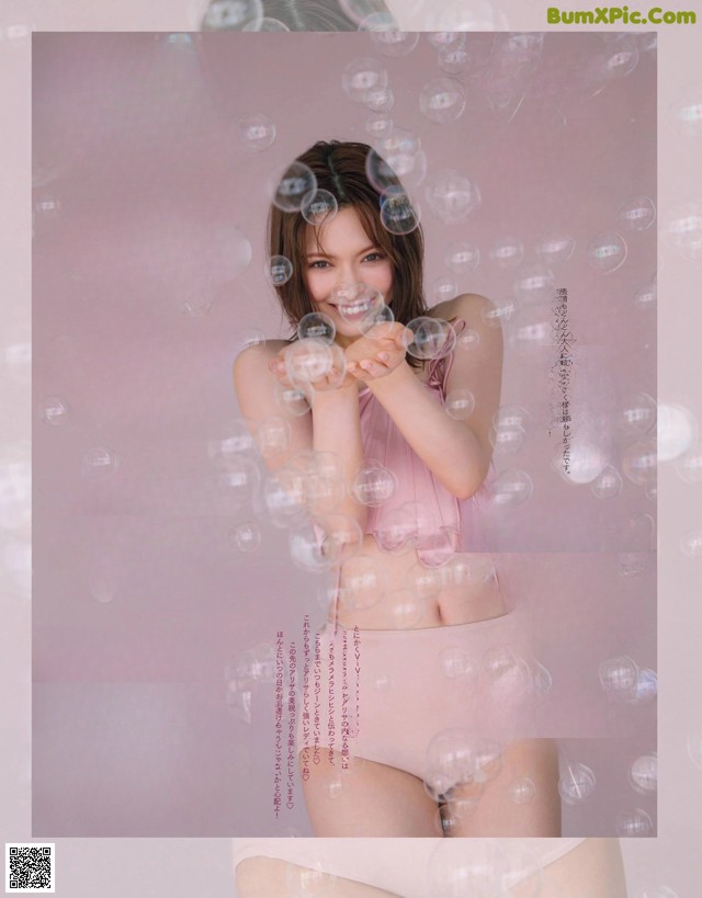 A magazine with a picture of a woman blowing bubbles.